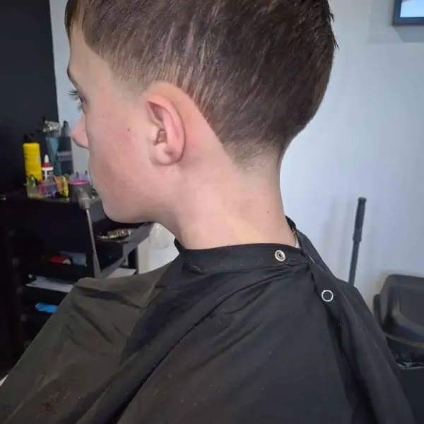 Gents low fade with styled top, side view