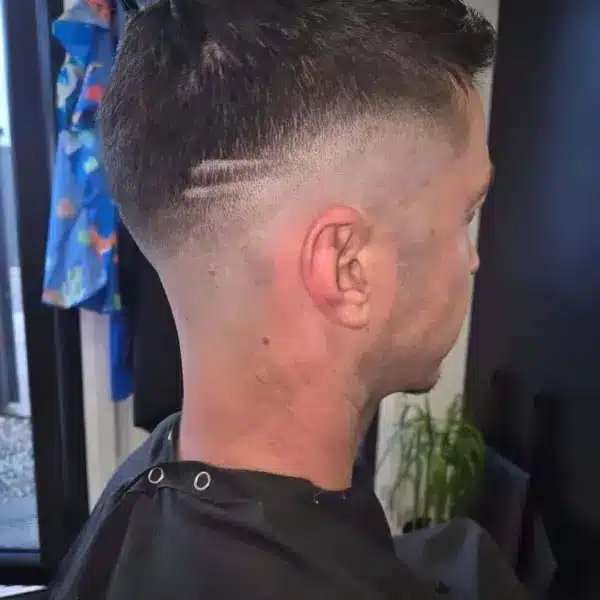 Skin fade with tight taper, rear view