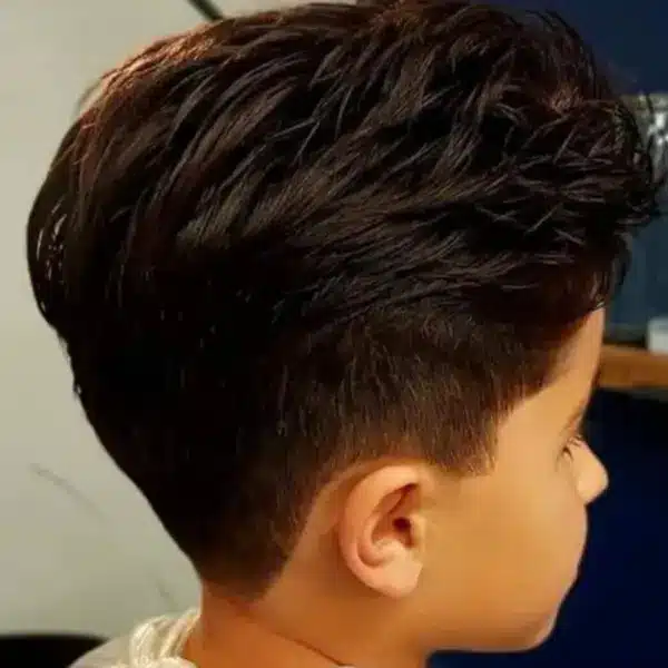 Gents skin fade with natural textured top, side view