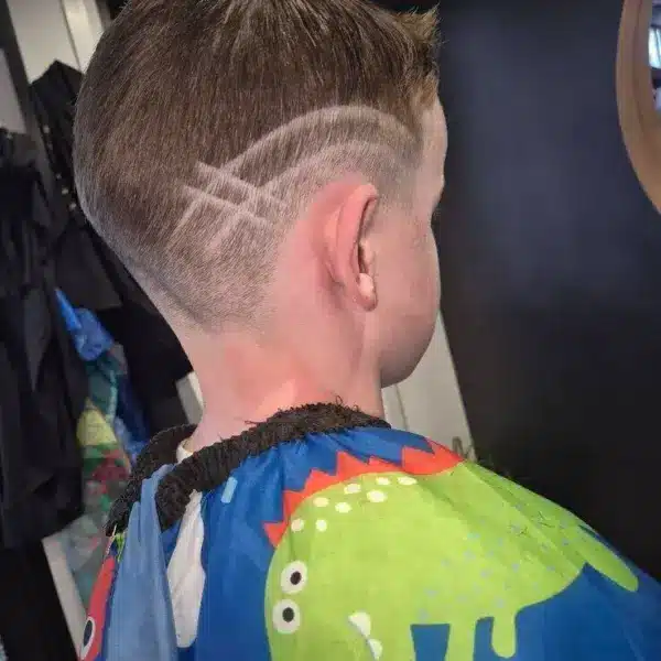 Boys haircut with design line, rear view